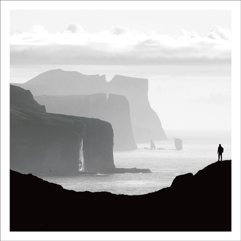 BW30 - Coastal cliffs with silhouette of a person looking at the horizon - Photographic Card